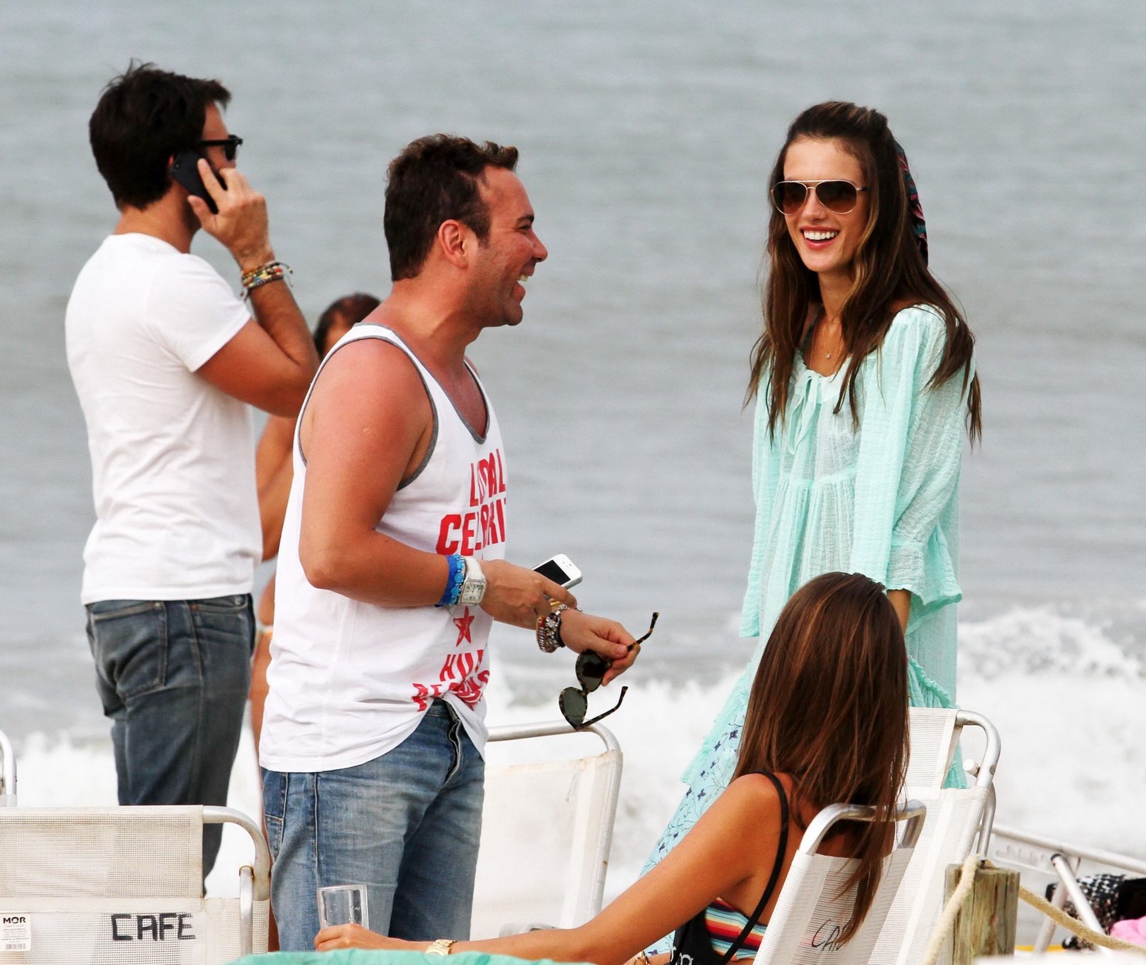 Alessandra Ambrosio in bikini buying a summer dress on a beach in Brazil #75244412