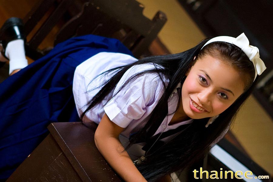 Thai teen girl in schoolgirl uniform strips #69948163