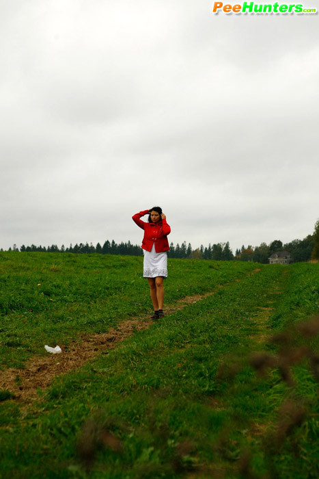 Girlie feeling cold takes a quick leak on a field #78691382