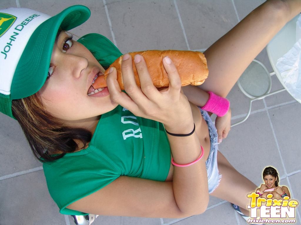 Eighteen year old Trixie Teen stripping while eating frankfurter #78781639