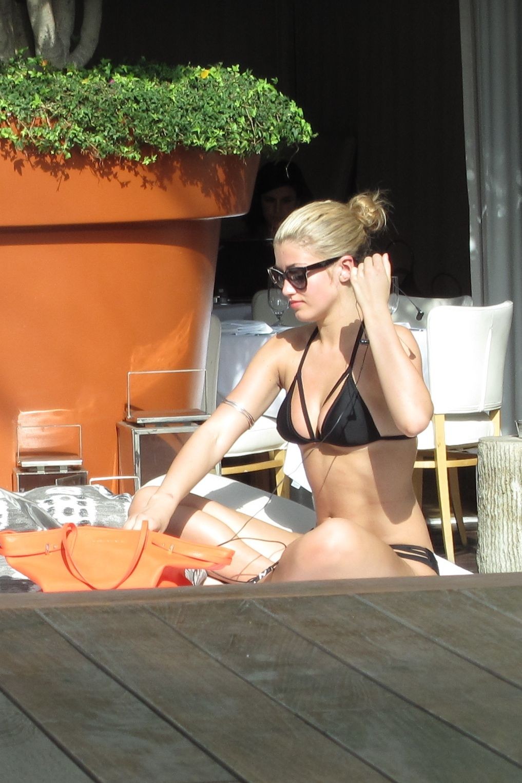 Amy Willerton in black bikini tanning in Los Angeles #75207033