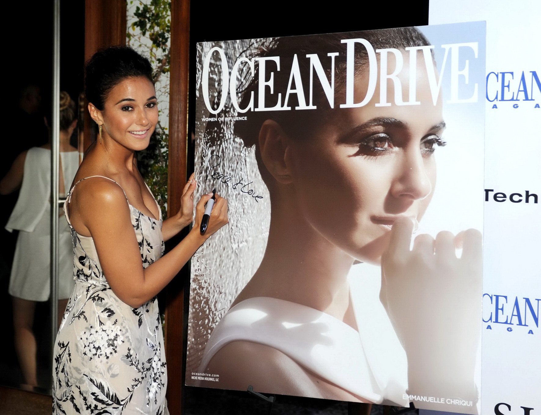 Emmanuelle Chriqui showing honorable cleavage on the Ocean Pressure Magazine Conceal Occasion