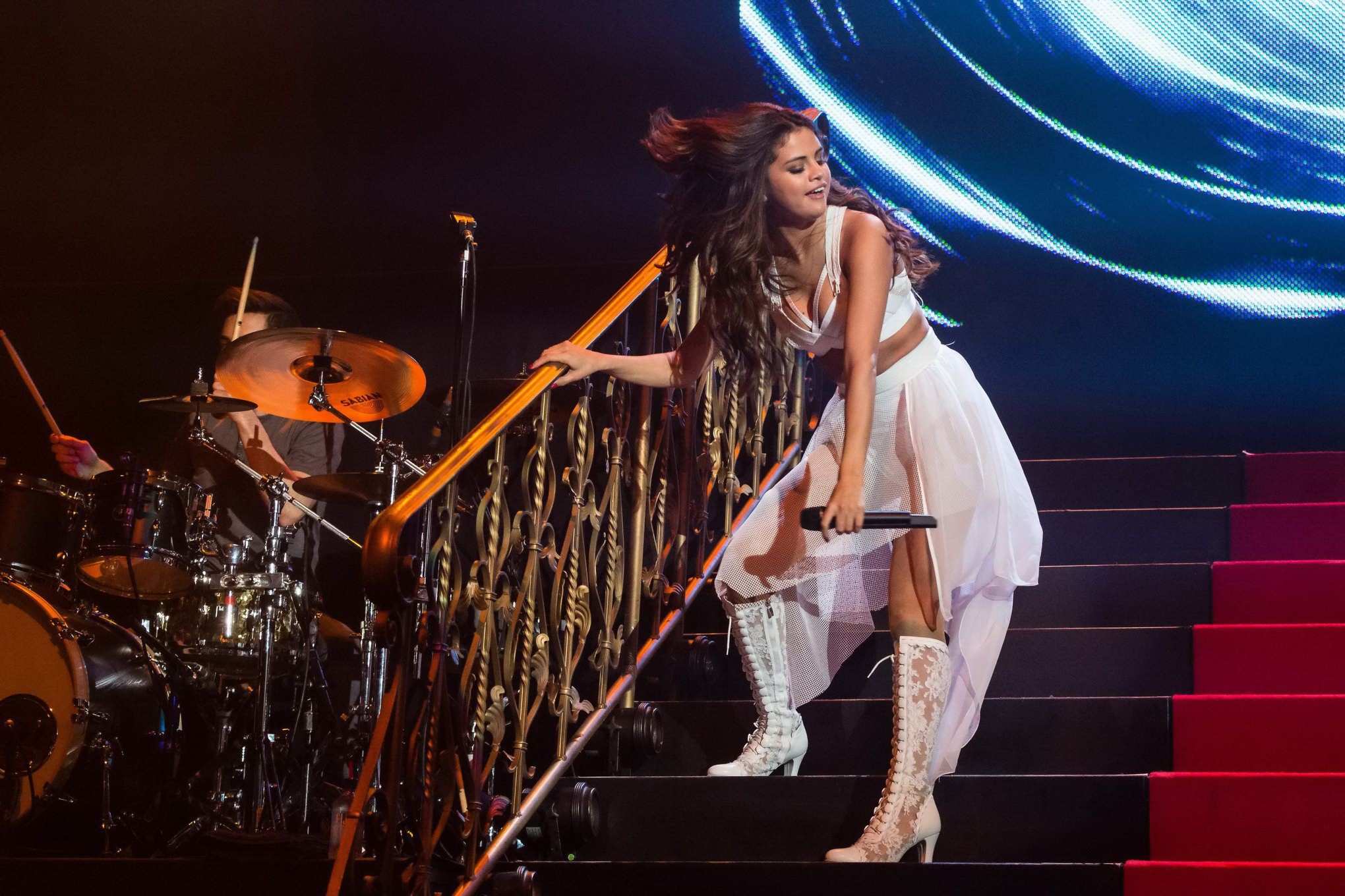 Selena Gomez wearing tiny white belly top and see-through skirt while performs a #75202384