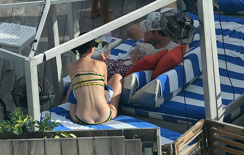 Katy Perry exposing sexy body and huge boobs in bikini at hotel pool