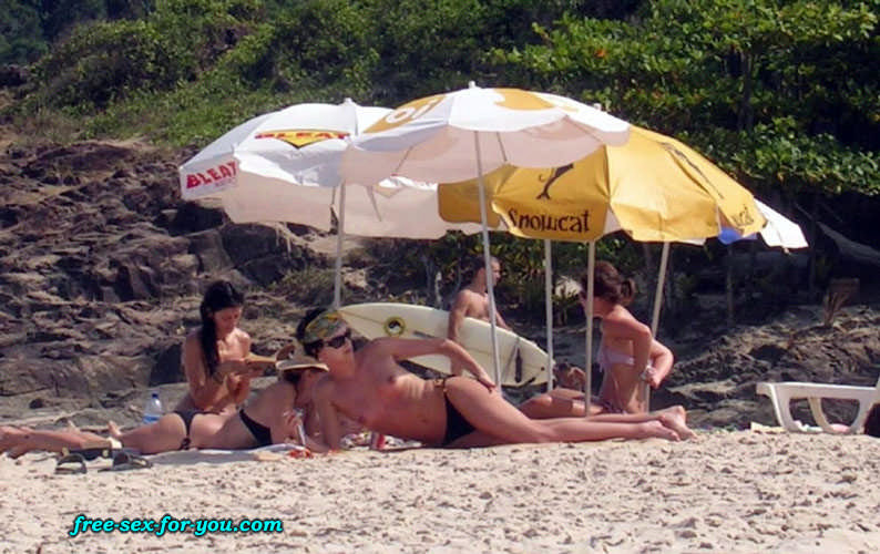 Charlize Theron showing tits in topless to paparazzi on beach #75436030