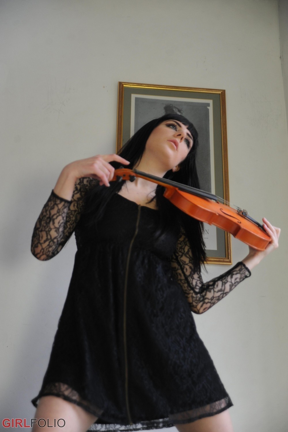 Leggy brunette stripping and posing with her violin #72426017