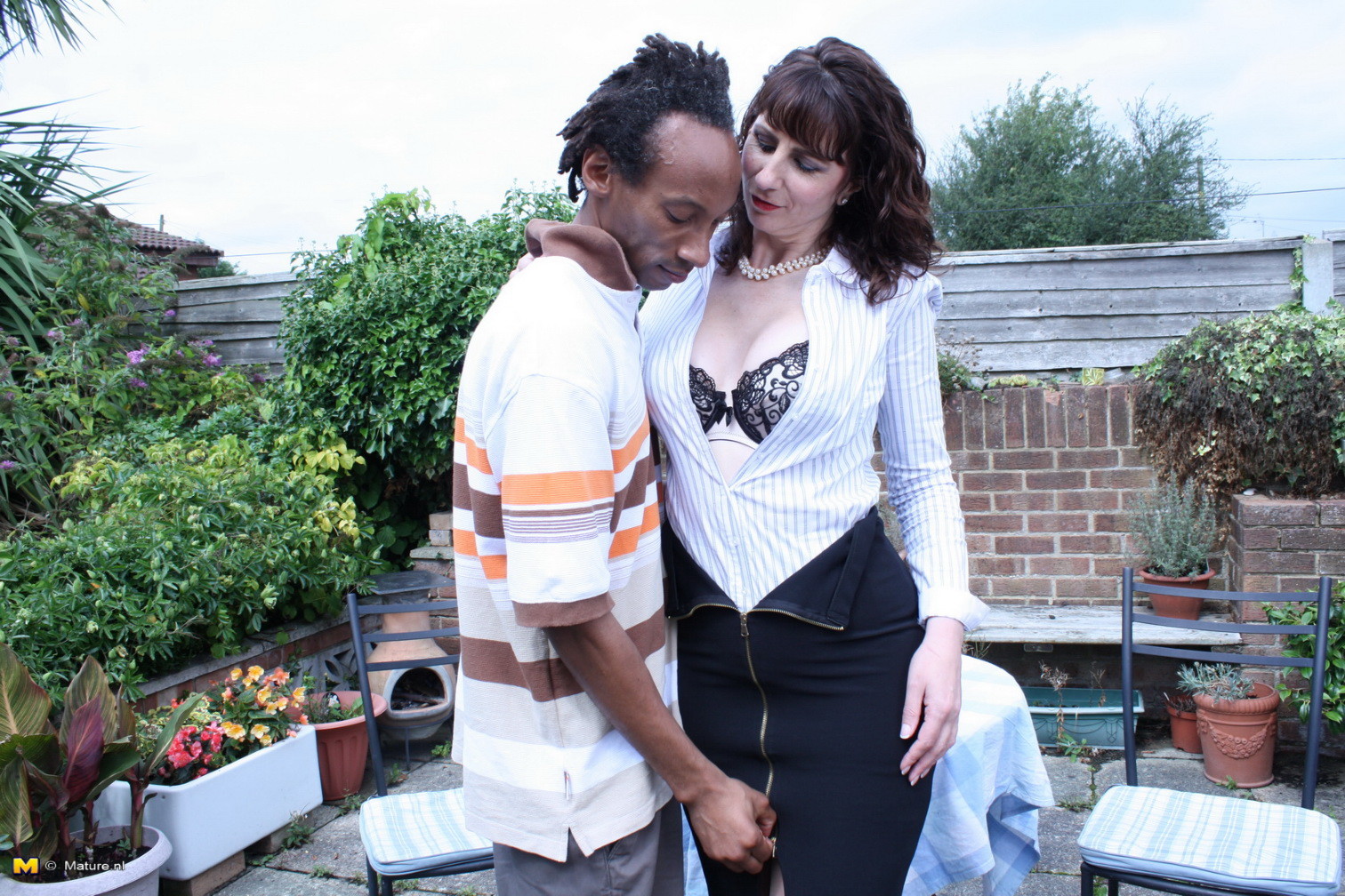 British mom fooling around with a black guy in her garden #76493470