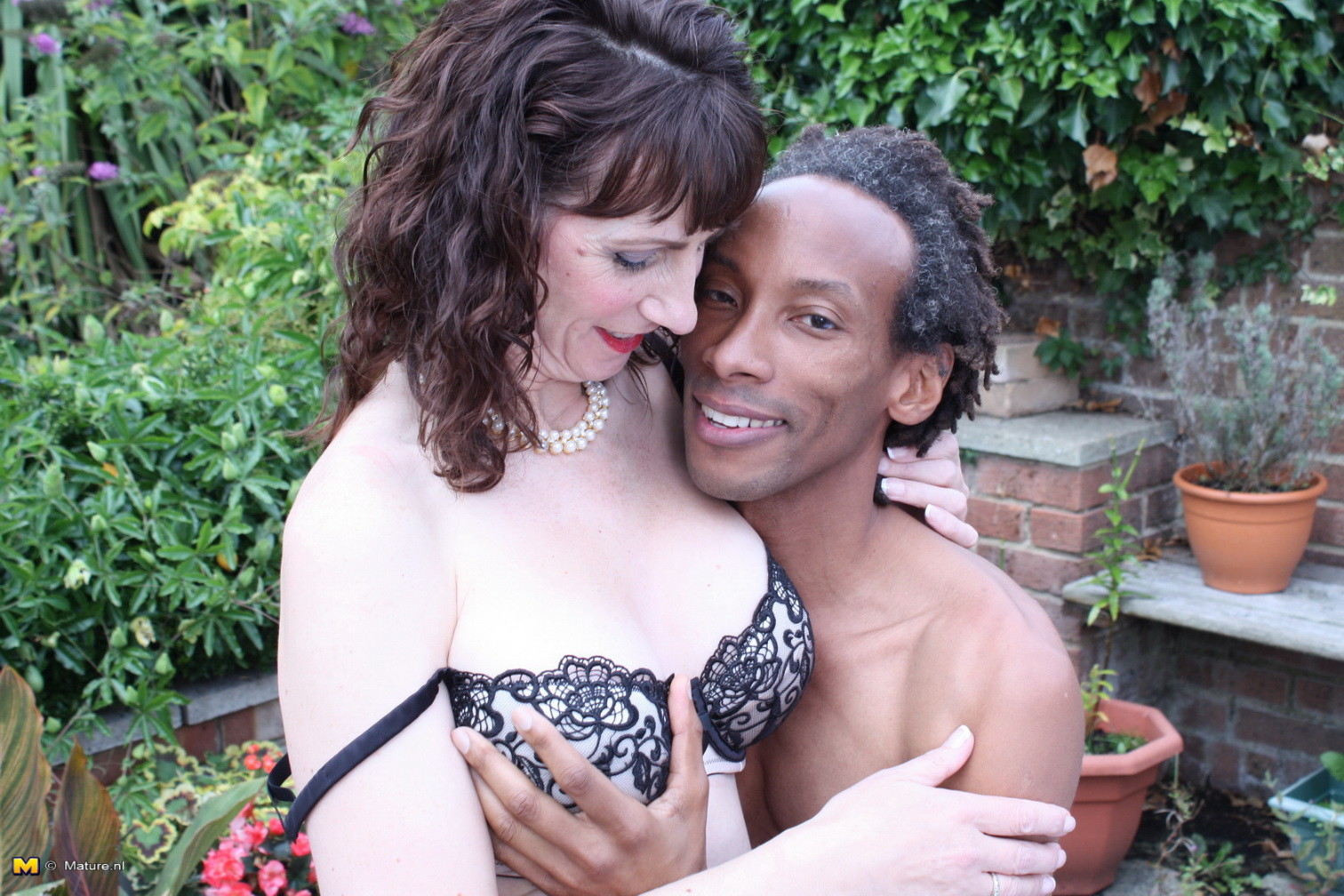 British mom fooling around with a black guy in her garden #76493519