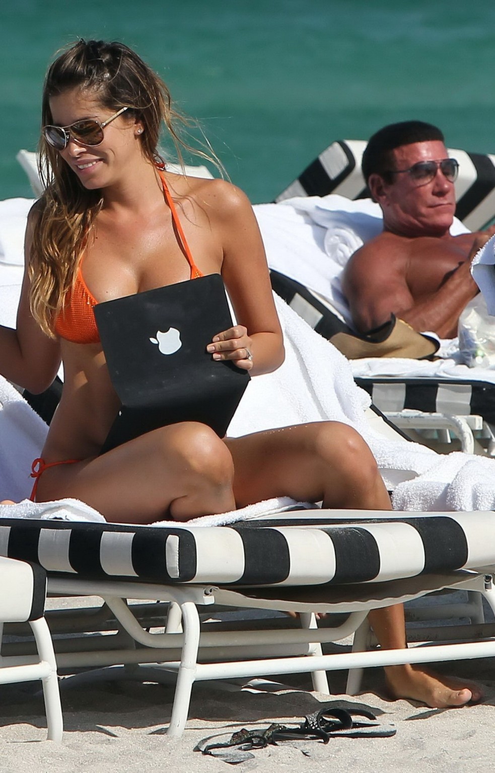 Aida Yespica busty wearing orange bikini on a beach in Miami #75278830