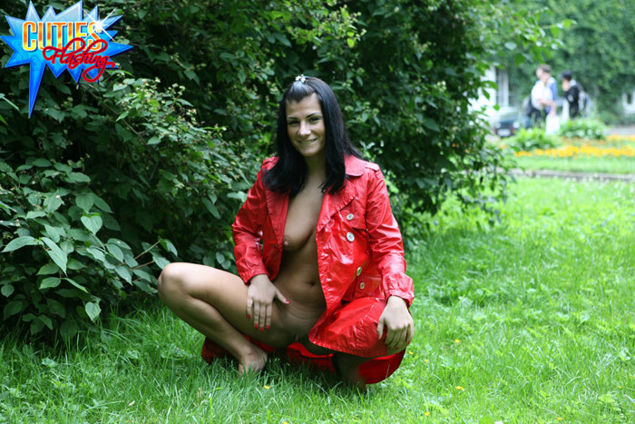 Sexual brunette girl in red leather coat flashing in the park #72615944