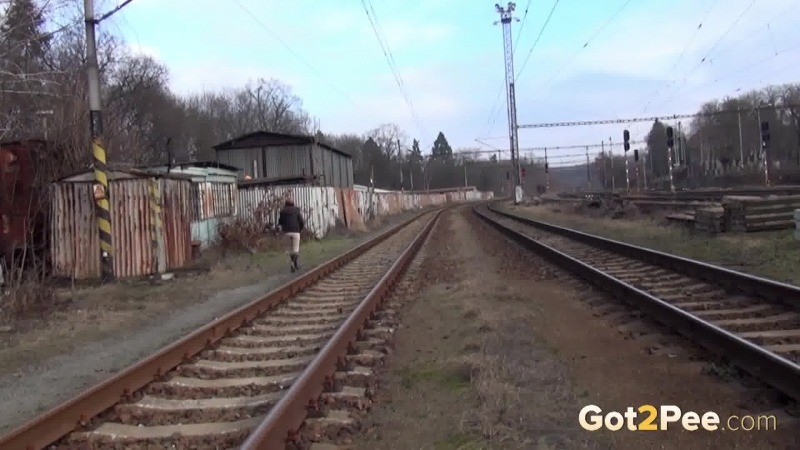 Brunette girl pulls down her trousers to pee outside #67493333