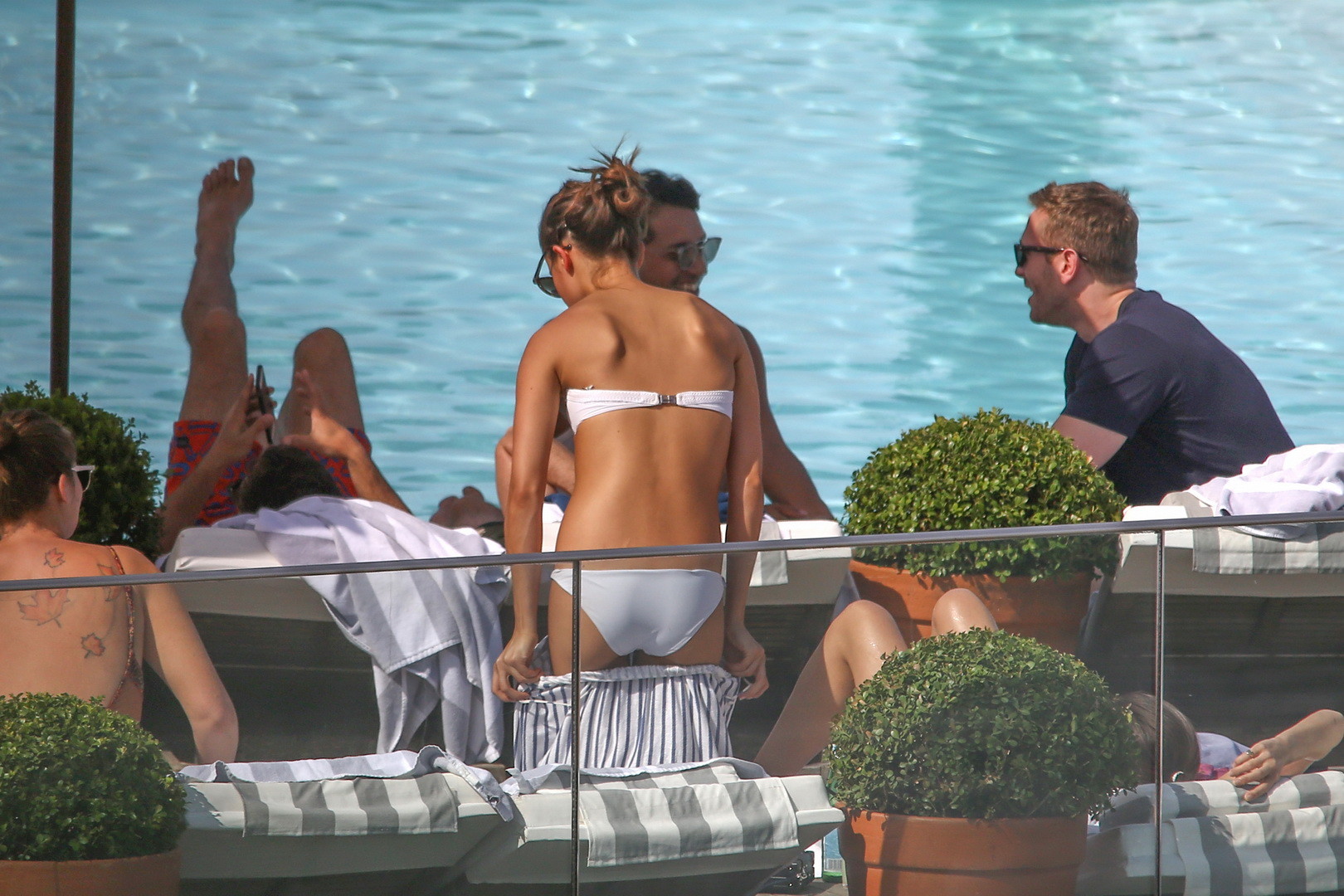 Alicia Vikander stripping to tiny white bikini poolside #75141710