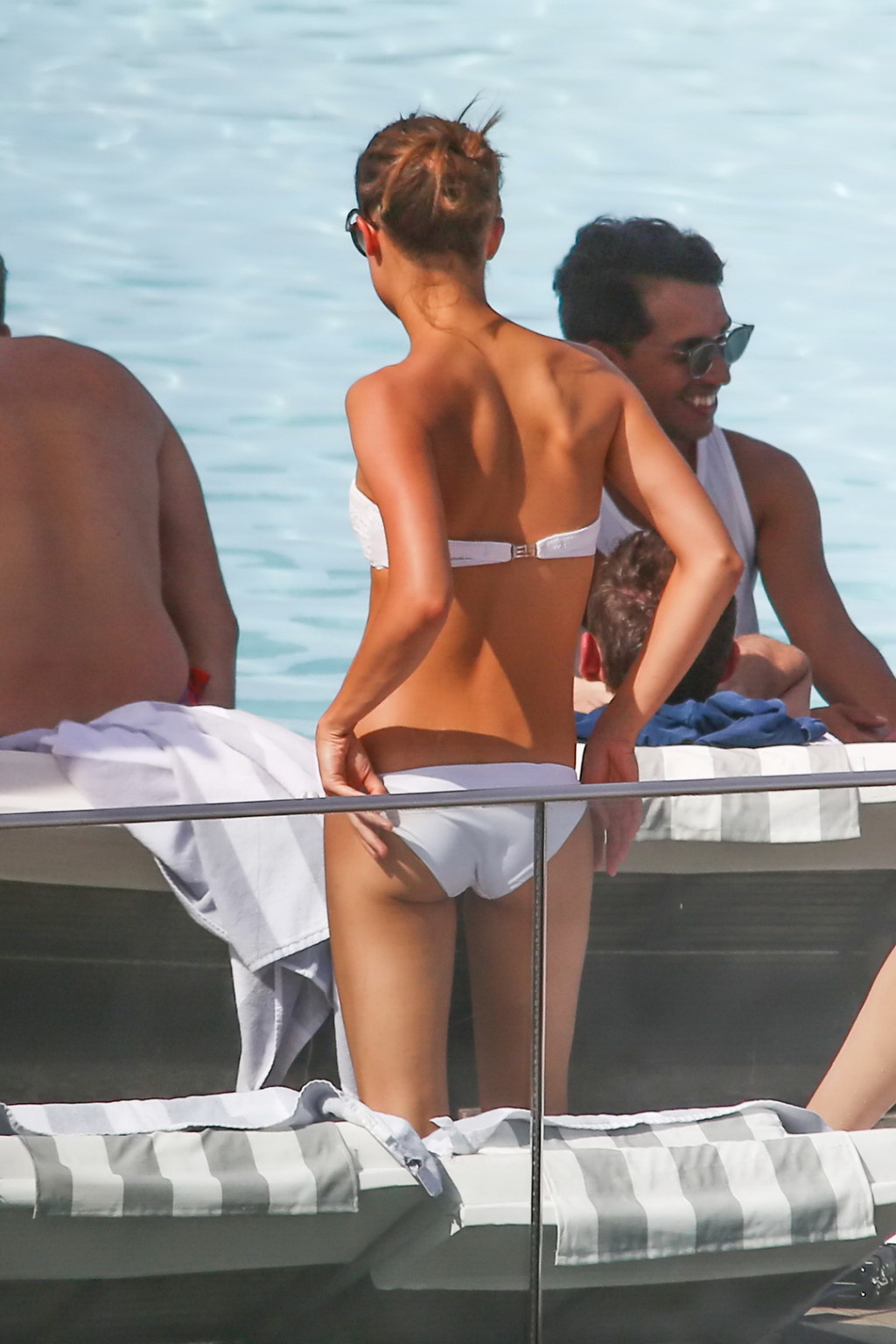 Alicia Vikander stripping to tiny white bikini poolside #75141980