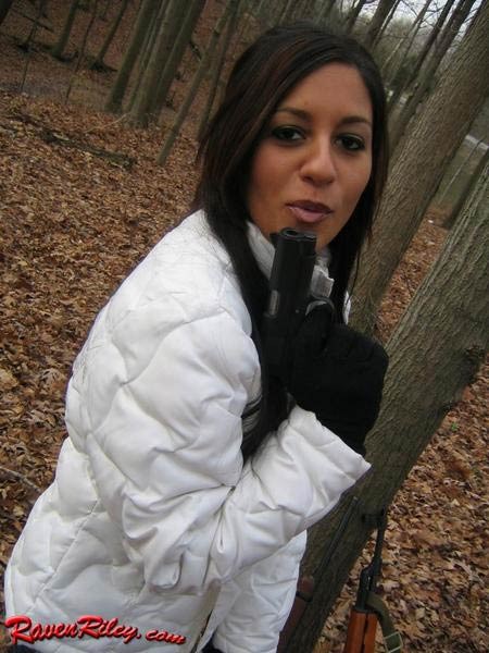 Babe posing with a gun in the woods #75101386