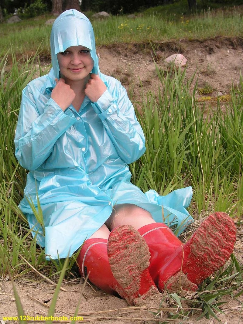 Cute redhead in sexy rubber boots and raincoat #76648012