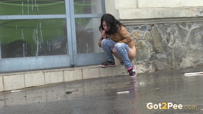 Gorgeous dark haired girl pees in public #67485586