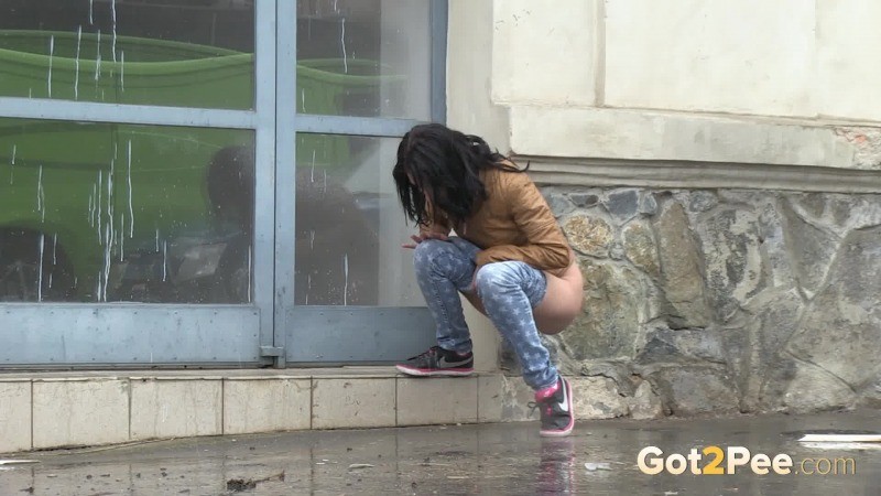 Gorgeous dark haired girl pees in public #67485603