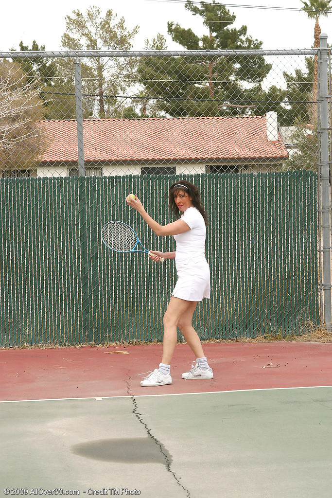 Older Brunette MILF Gets Ready To Plunge A Tennis Racquet