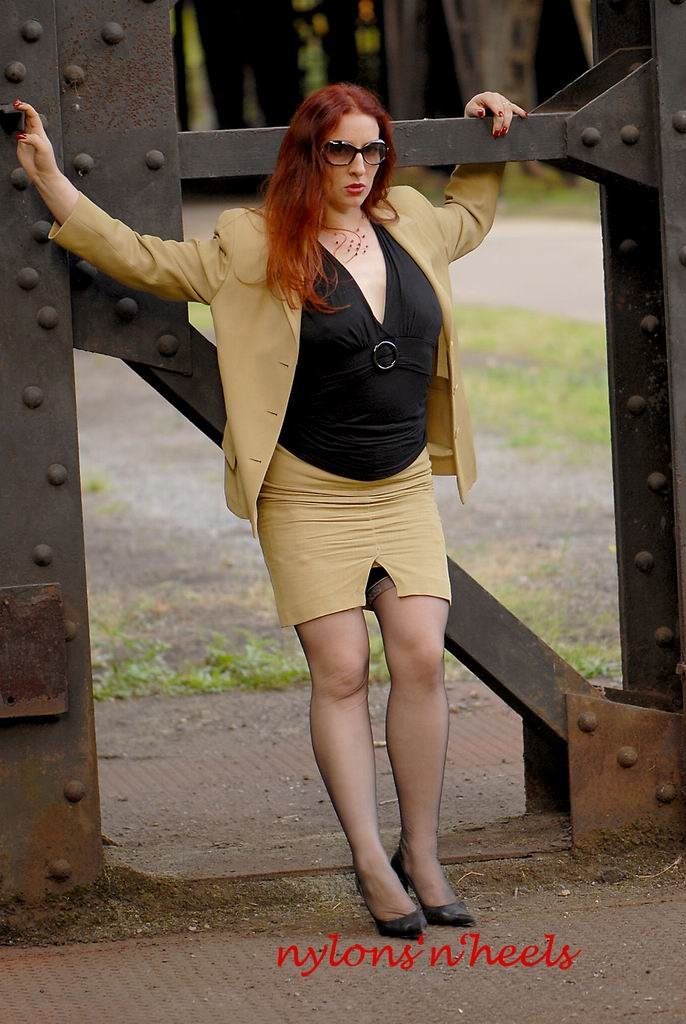 Redhead lady Justine in stockings spreading outdoors #78617328