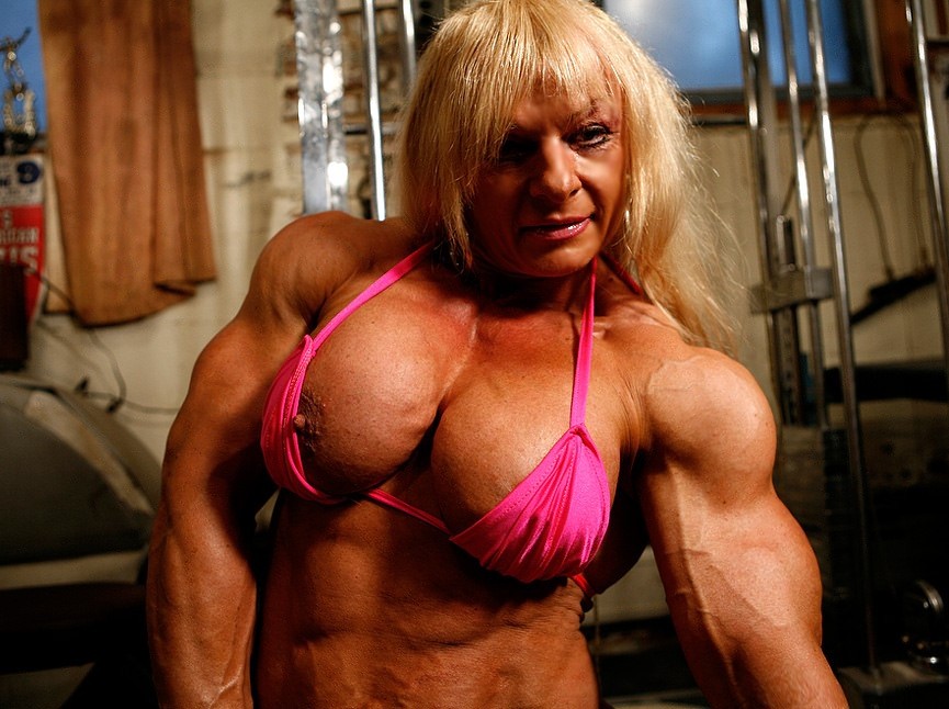 Truly massive and ultra ripped female muscle beast posing sexy #76520581