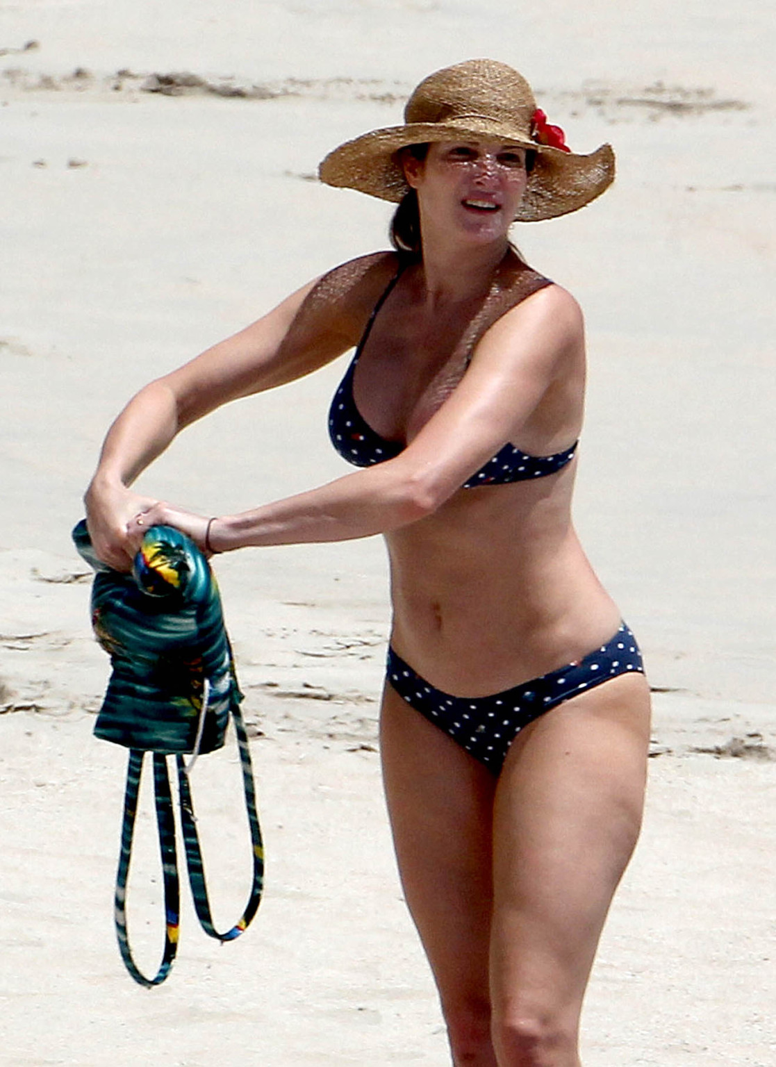 Stephanie Seymour busty wearing polka dot bikini on the beach in St. Barts #75311352
