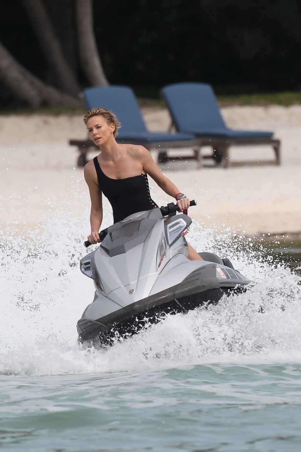 Charlize Theron jet skiing in black monokini during the photoshoot in Miami Beac #75201215