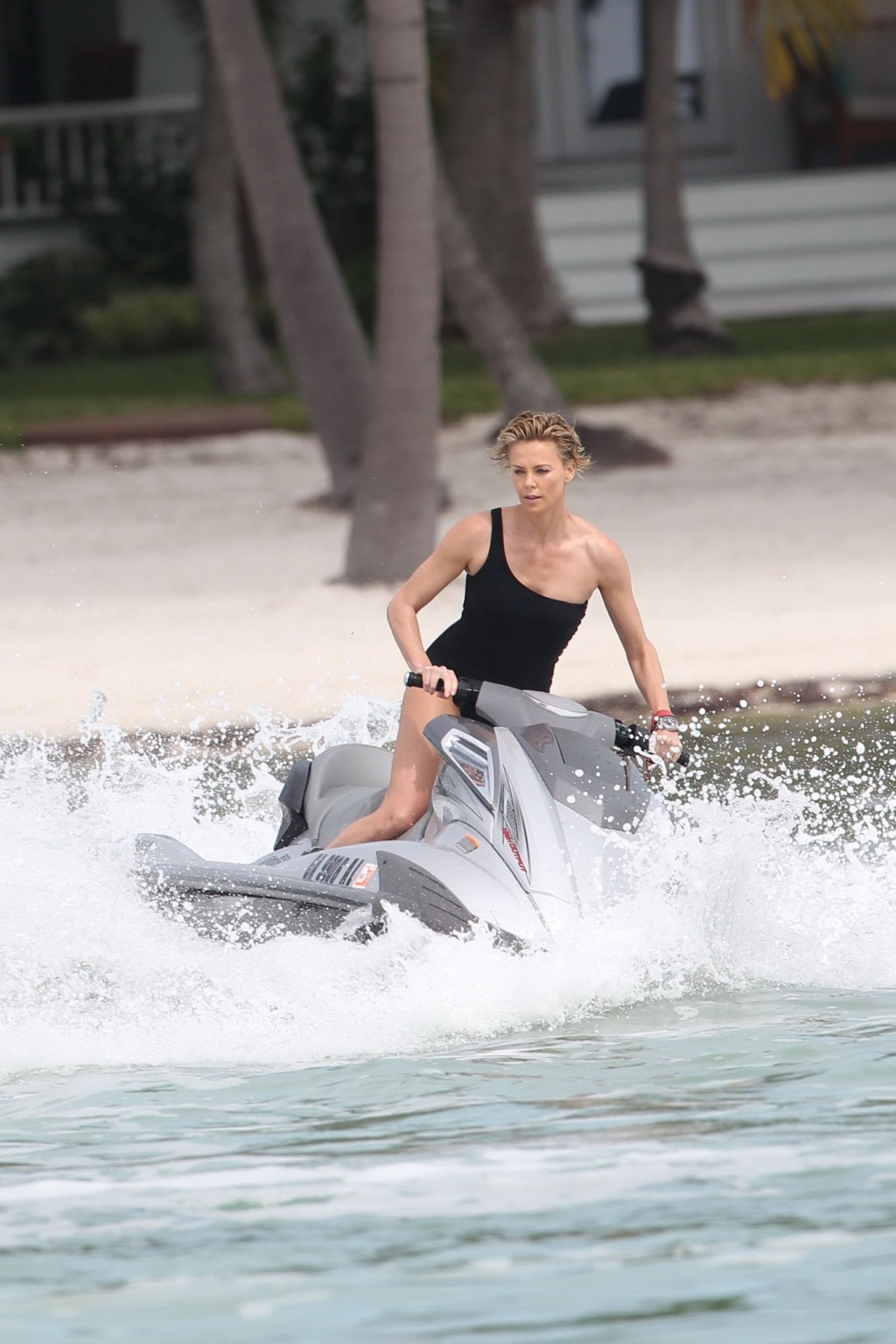 Charlize Theron jet skiing in black monokini during the photoshoot in Miami Beac #75201260