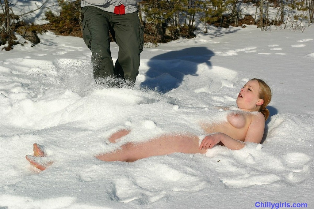 Naked girl freezing in snow #73253973