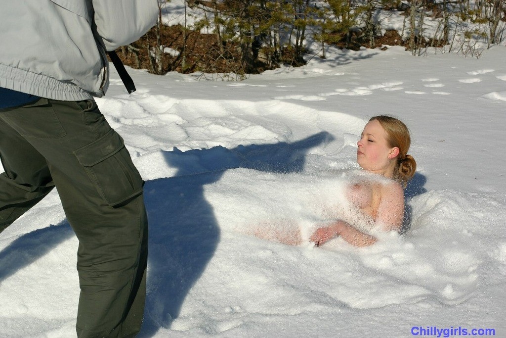 Naked girl freezing in snow #73253979