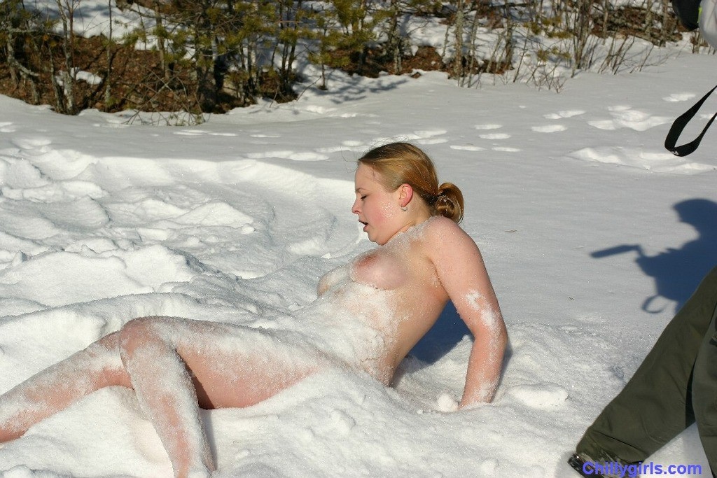 Naked girl freezing in snow #73254005