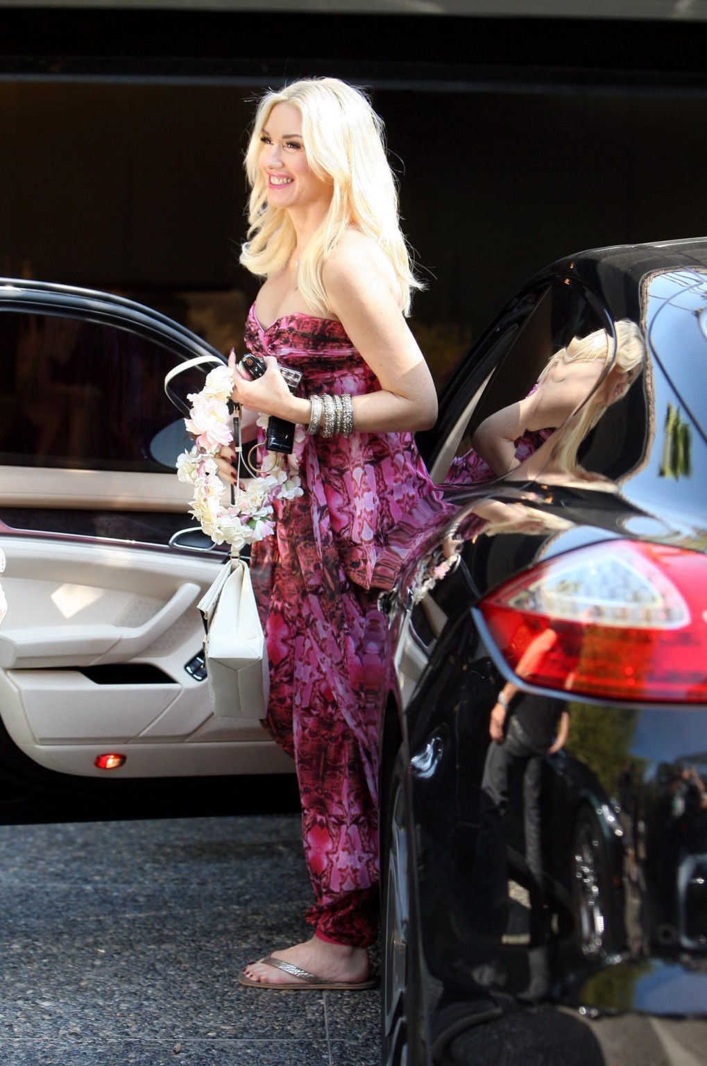 Gwen Stefani shows off her breast implants wearing a strapless dress outside a f #75214156