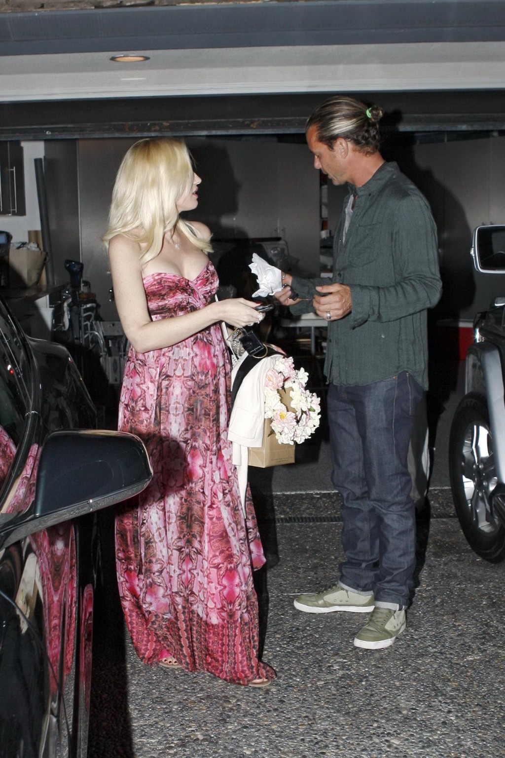 Gwen Stefani shows off her breast implants wearing a strapless dress outside a f #75214192