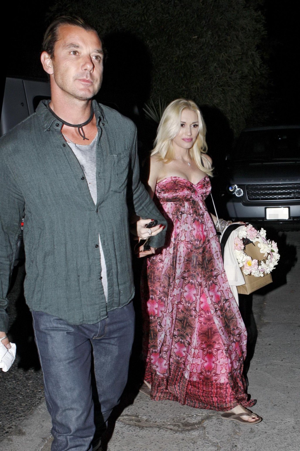 Gwen Stefani shows off her breast implants wearing a strapless dress outside a f #75214231