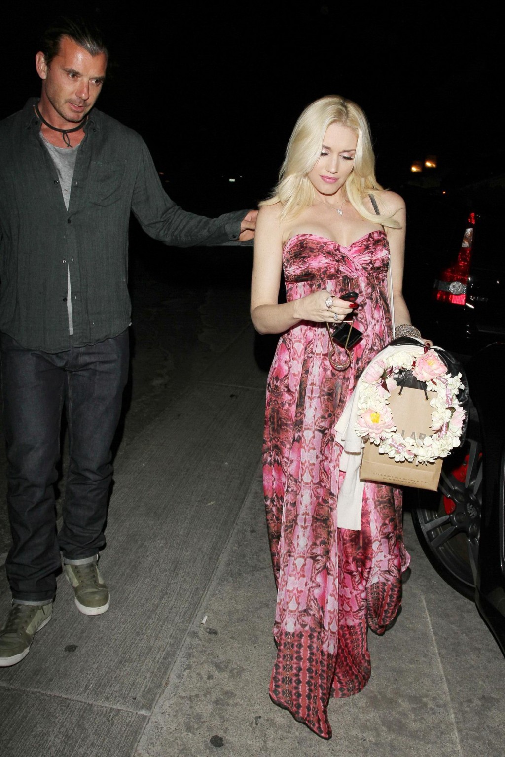 Gwen Stefani shows off her breast implants wearing a strapless dress outside a f #75214255