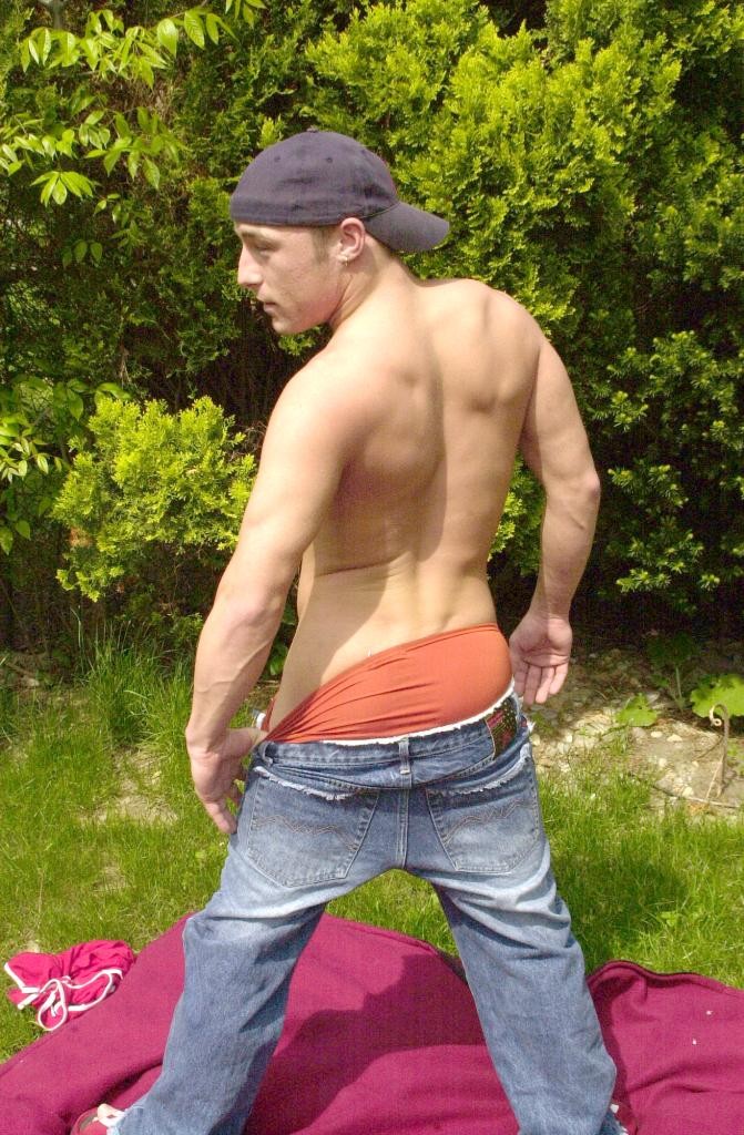 Outdoor horny gay twink strip teasing and spreading his ass #76995348