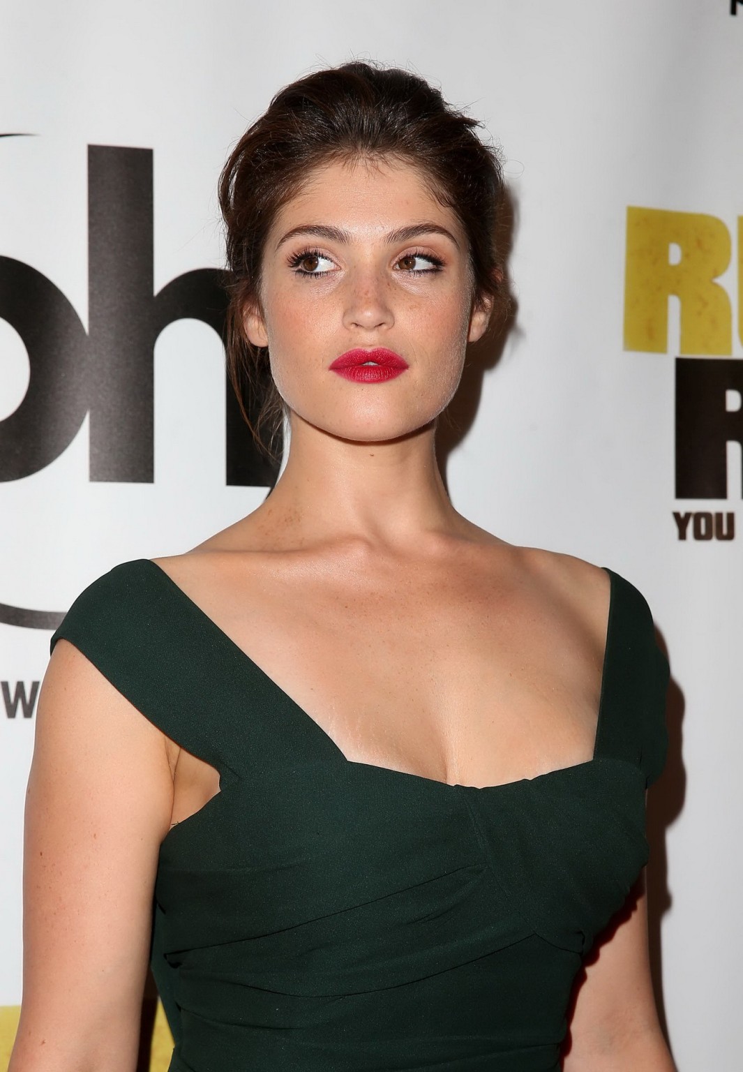 Gemma Arterton showing big cleavage in a green bareback maxi dress at the Runner #75219056