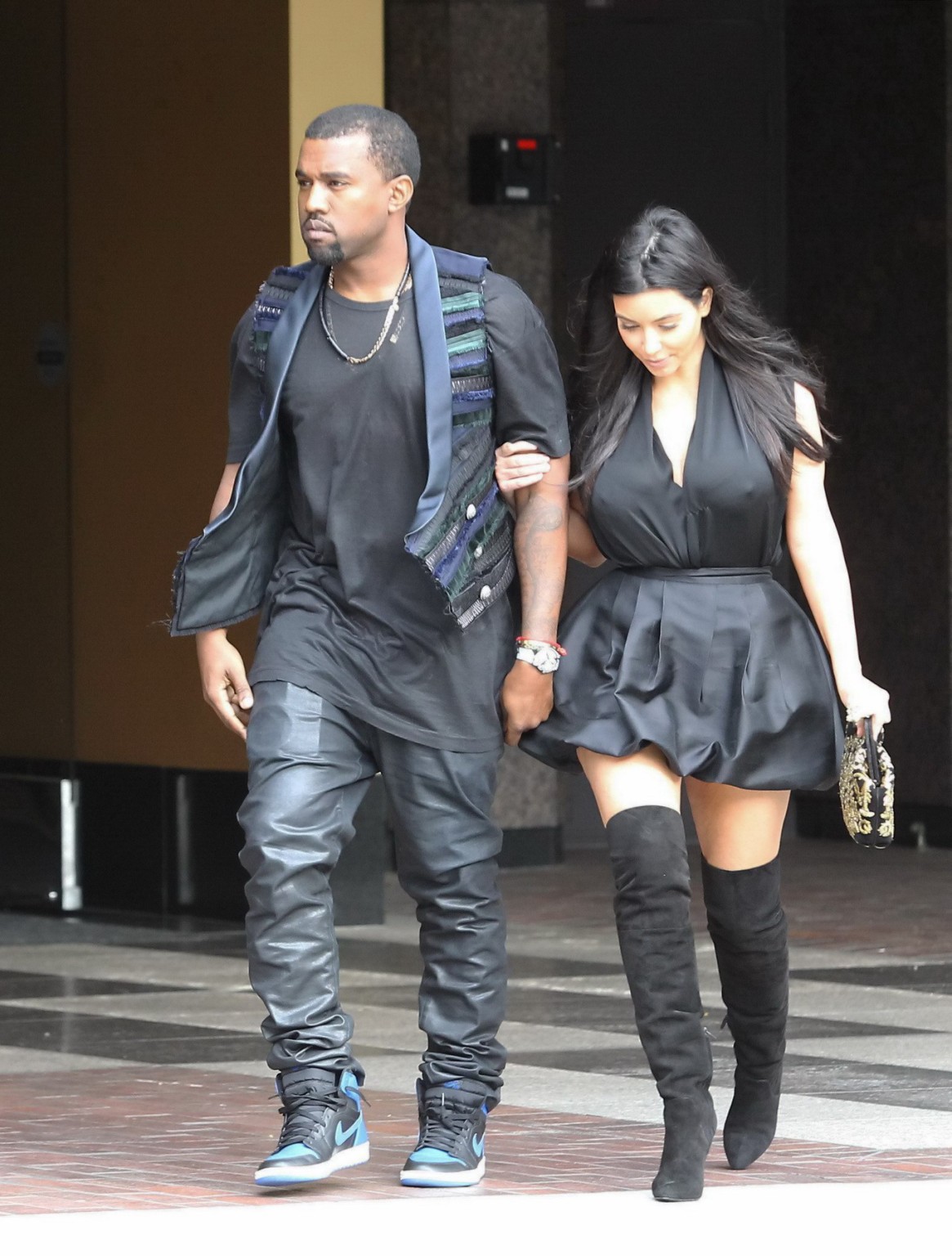 Kim Kardashian cleavy and leggy in black mini dress at Kung Pao Bistro in West H