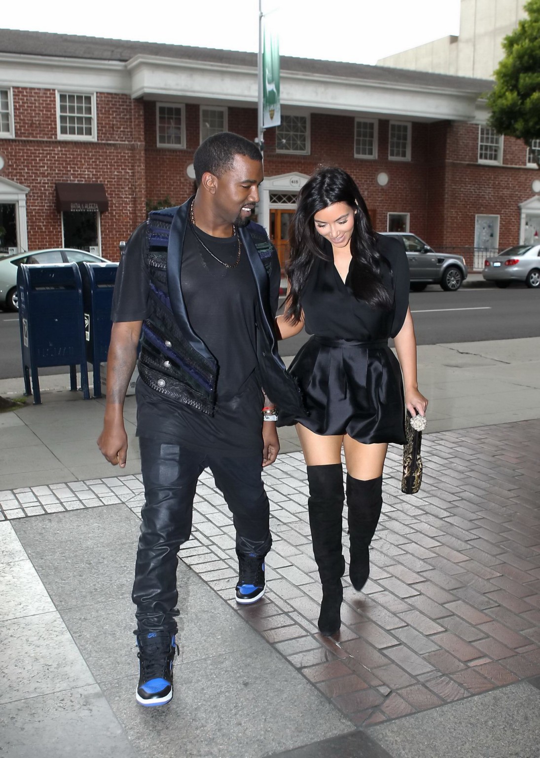 Kim Kardashian cleavy and leggy in black mini dress at Kung Pao Bistro in West H #75245284