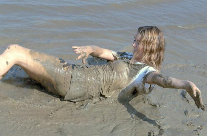 Beautiful amateur gal laying in mud #76623905