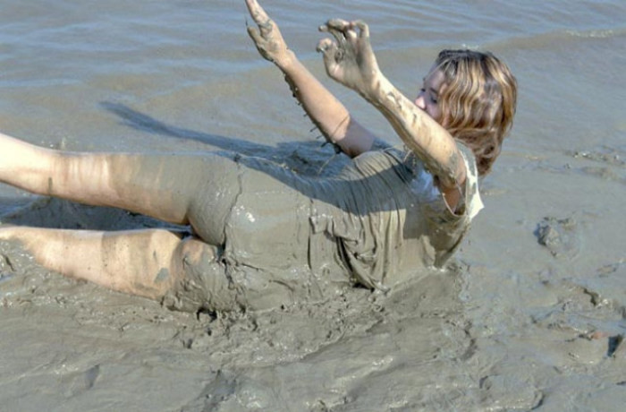 Beautiful amateur gal laying in mud #76623923