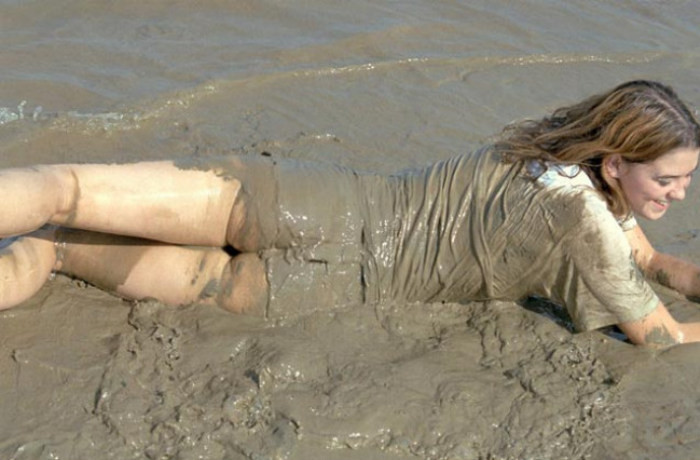 Beautiful amateur gal laying in mud #76623926