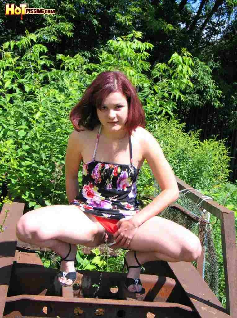 Cute girl pissing outdoors #76585415