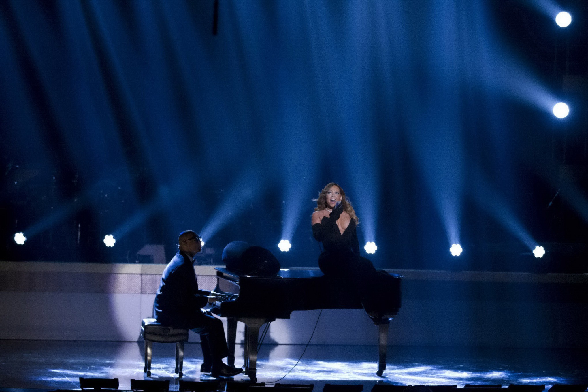 Mariah Carey braless showing huge cleavage in a tight black dress while performs #75205495