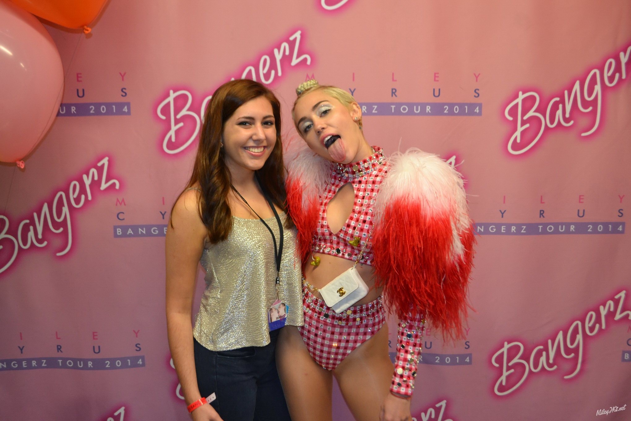 Miley Cyrus licking a fan while posing for Meet and Greet event at United Center #75188115
