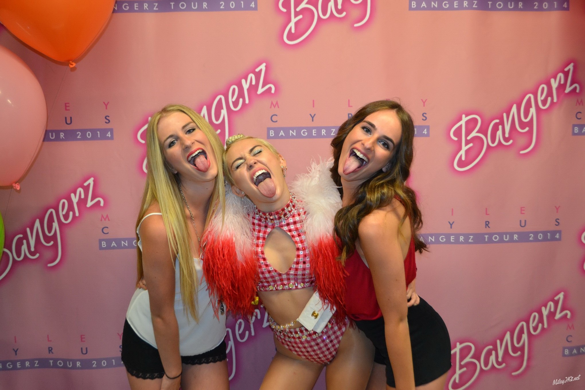 Miley Cyrus licking a fan while posing for Meet and Greet event at United Center #75188148