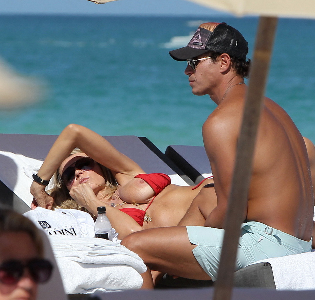 Rita Rusic nipple slip on a beach in Miami, Florida #75269129