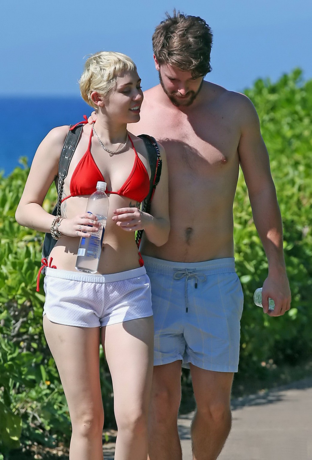 Miley Cyrus Wearing Tiny Red Bikini And Seethrough Shorts At A Vacation In Hawai