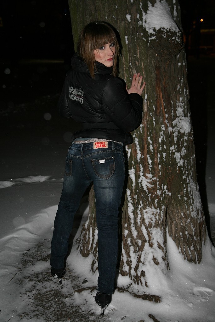 Babe in blue jeans with very long legs teases person with her limited ass
