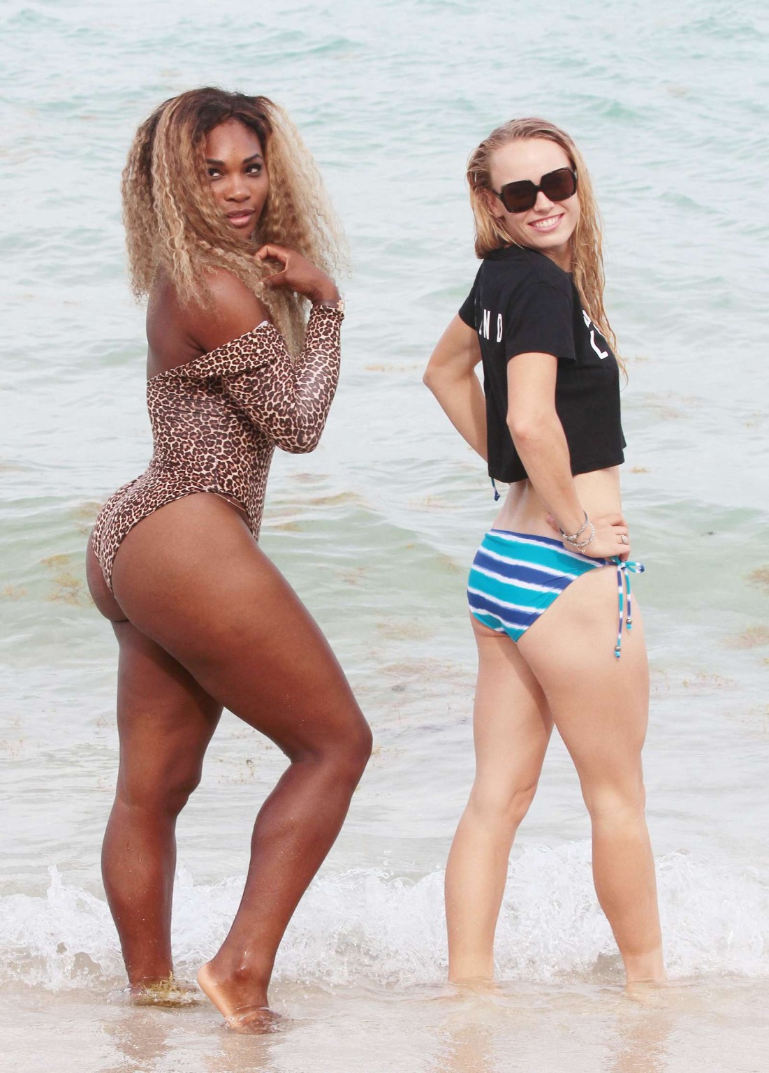 Serena Williams shows off her curvy body wearing a leopard print swimsuit on a b