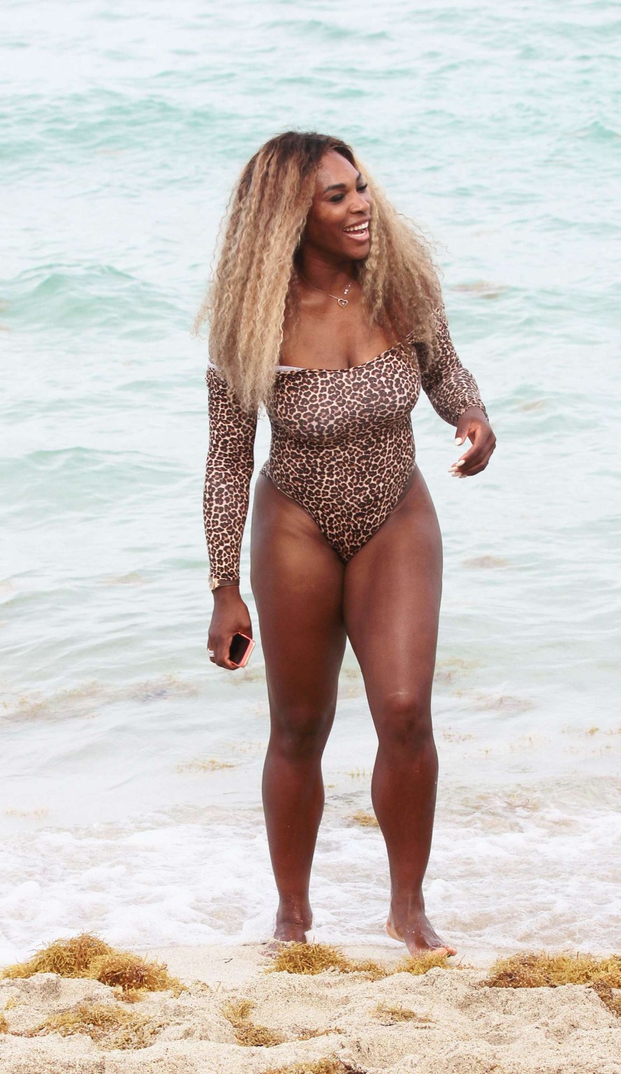 Serena Williams shows off her curvy body wearing a leopard print swimsuit on a b #75194774